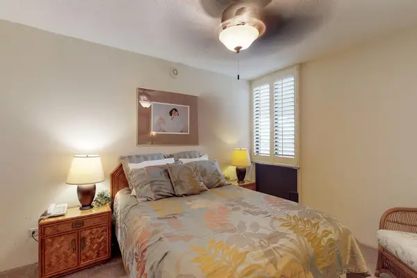 Peaceful bedroom with warm decor and comfortable bedding