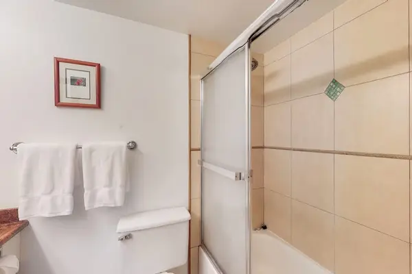 Clean tub-shower combination with convenient built-in shelving