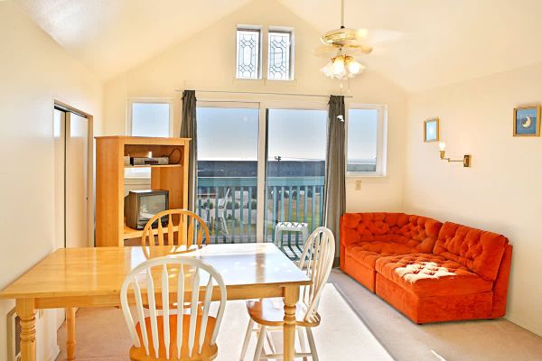 1BR beachfront condo, kitchen, & sea-view balcony