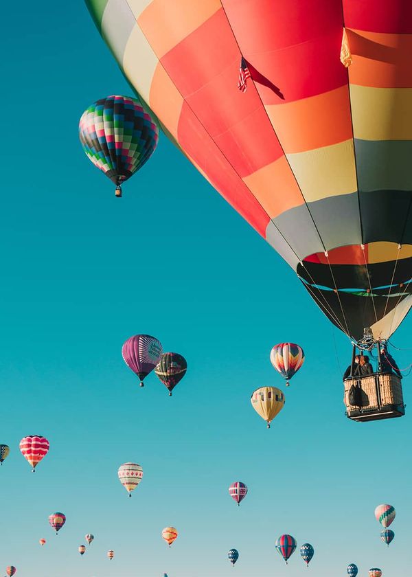 Colorful hot air balloons over Kissimmee, enhancing the allure of our nearby vacation homes managed by our expert vacation rental management team.