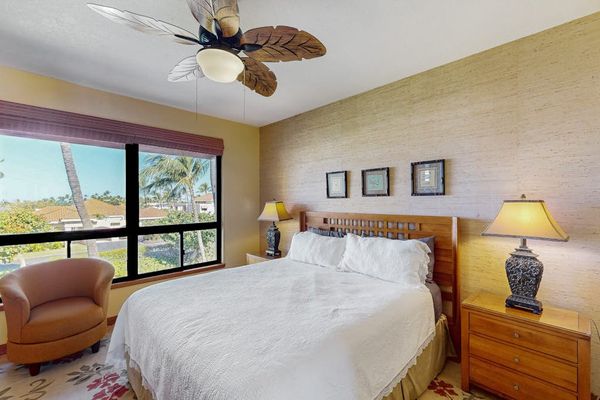Bright Primary Suite with King Bed, Tropical Ceiling Fan & Ocean-Breeze Windows