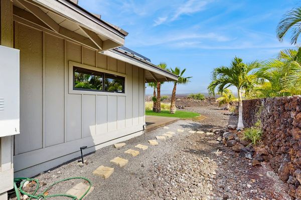 Side Stepping-Stone Walkway Surrounded by Tropical Palms