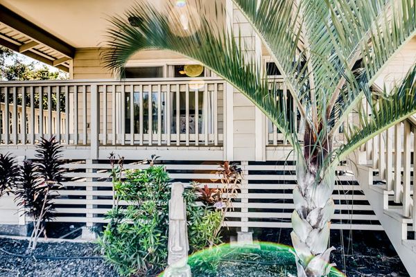 Inviting Front Porch With Tropical Charm