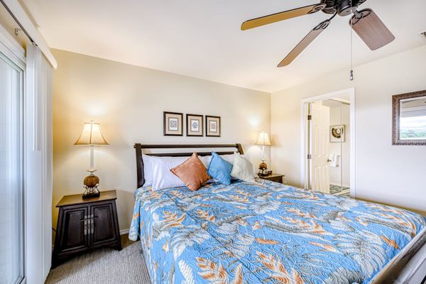 Comfortable king bedroom with natural light