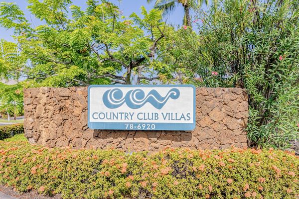 Easily locate the property by looking for the prominent Country Club Villas sign at the entrance