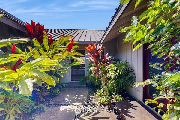 Private Courtyard Entryway Framed by Lush Tropical Foliage
