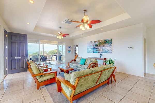 Relaxing lounge offers comfortable seating beside scenic island views indoors