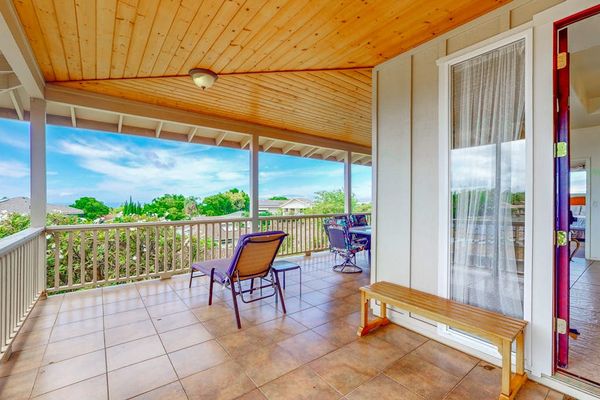 Wraparound balcony offers spacious outdoor seating overlooking beautiful island scenery
