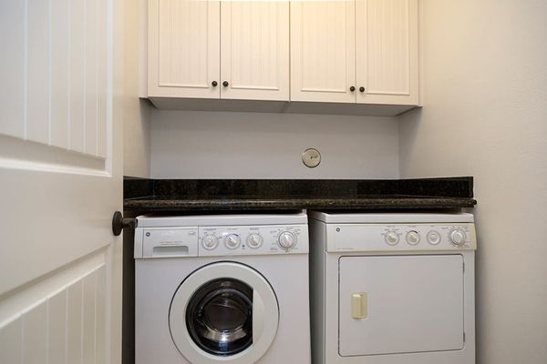 In-Unit Laundry Nook with Washer, Dryer & Overhead Storage