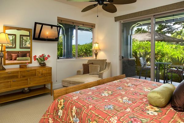 Bright Primary Bedroom with Flat-Screen TV, Chaise Lounge & Garden Views