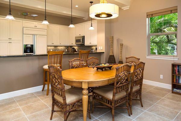 Elegant Dining Area with Seating for Six Adjacent to Kitchen Bar