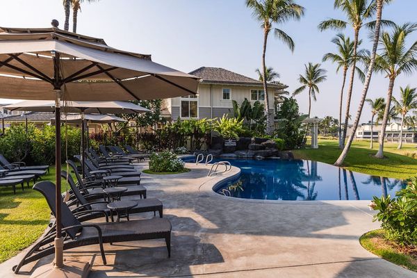 Resort Swimming Pool Deck with Sun Loungers & Umbrellas