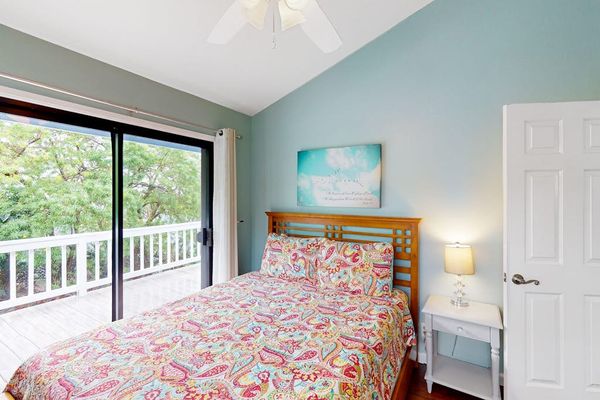 Bright Queen Bedroom featuring a large comfortable bed, bedside storage, and sliding doors with direct access to the private balcony! 🛌✨