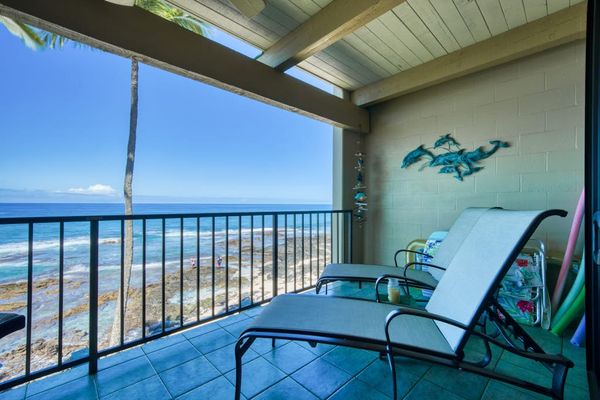 Scenic private balcony featuring comfortable lounge chairs and breathtaking, direct views of the ocean