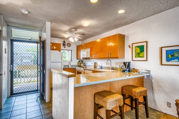 Functional kitchen area featuring a breakfast bar with barstools and plenty of counter space