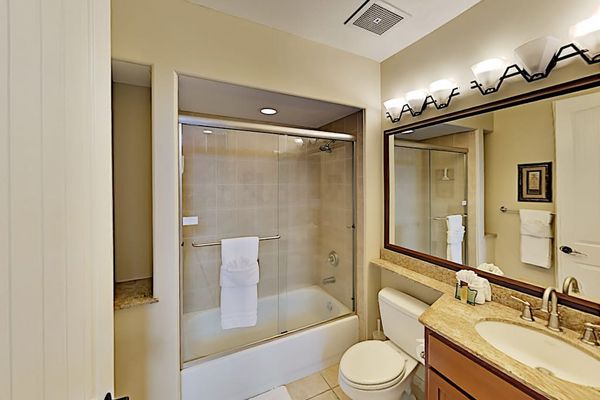 Guest bathroom with tub/shower combo.