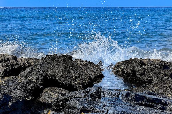 Waves Crashing Along Lava Shores