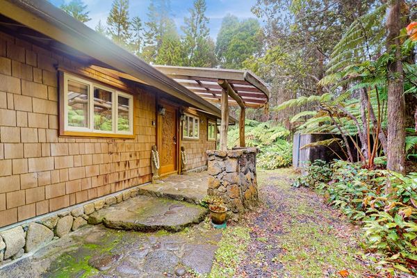 Welcoming entrance surrounded by lush greenery