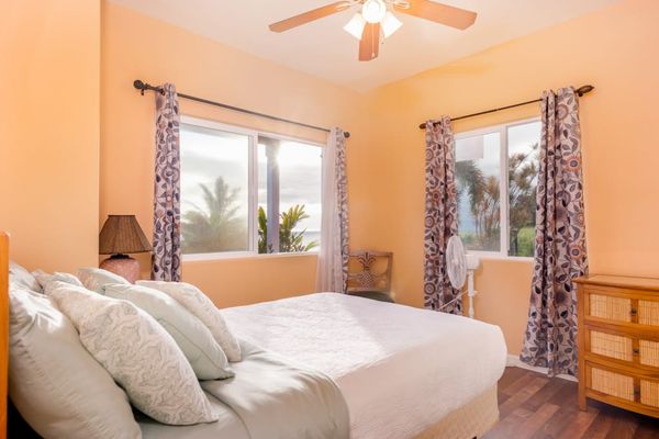 Bright Corner Bedroom With Tropical Views