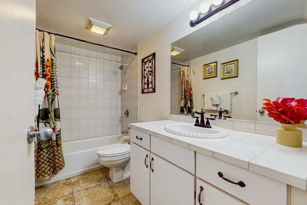 Bright guest bathroom with ample counter space.