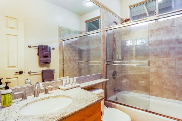 Elegant Bathroom With Glass Tile Shower
