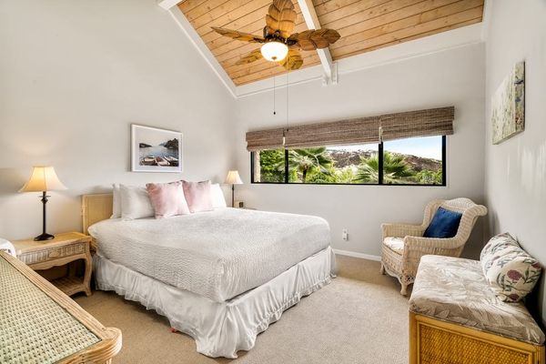 Relax in the spacious primary bedroom, complete with a dedicated reading nook and beautiful natural light