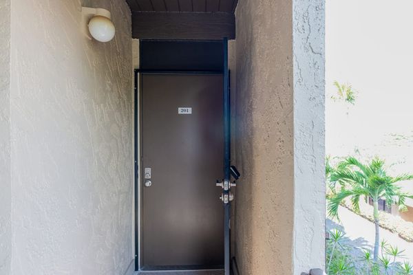 Glass Sliding Door Access, Exterior Lighting & Scenic Palm Views