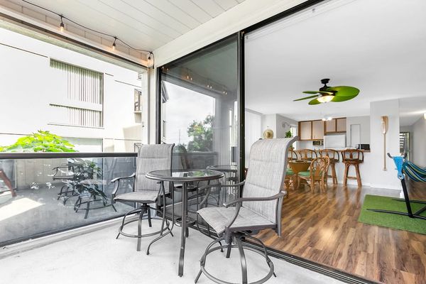 Private Covered Balcony with Patio Seating & Indoor-Outdoor Flow
