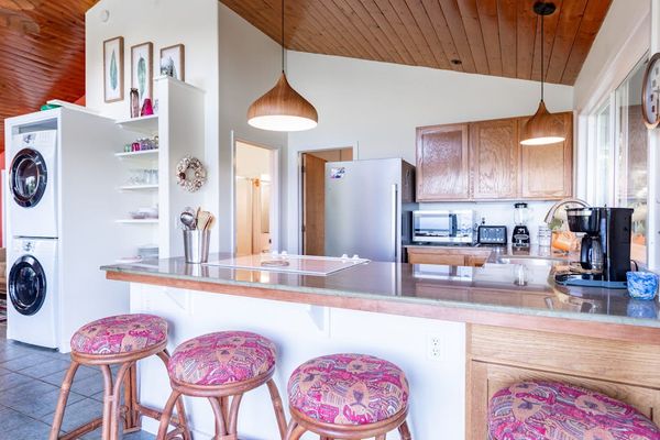 Kitchen Breakfast Bar with In-Unit Stacked Washer & Dryer