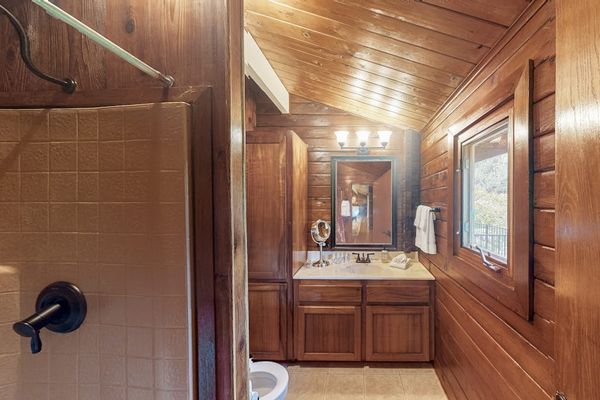 Full bathroom with a walk-in shower.