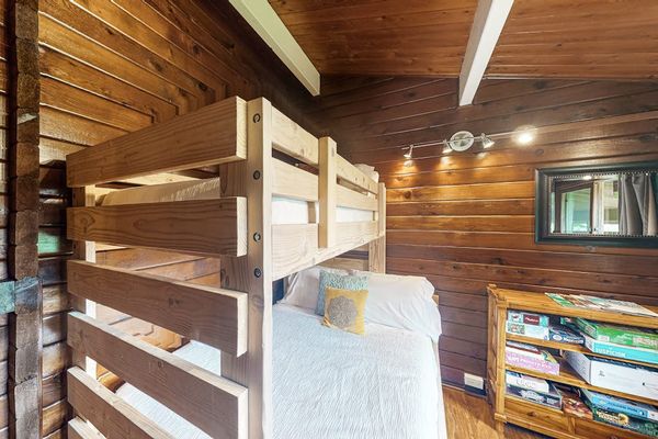 Guest room with bunk beds with a double and twin bed.