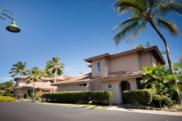 Welcoming resort entrance lined with palm trees
