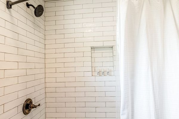 The Oasis Bath Shower with Subway Tile & Built-In Niche