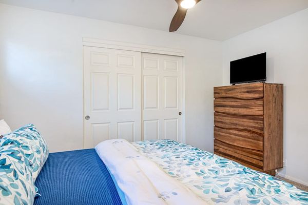 Spacious Primary Bedroom With Smart TV