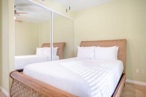 Queen Guest Suite Bed with Crisp Linens & Mirrored Closet Storage