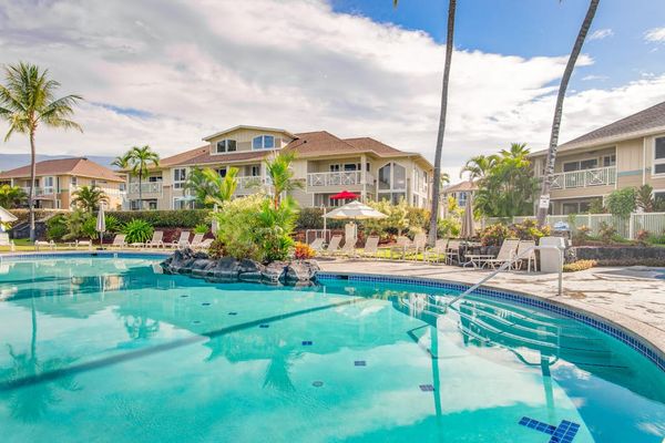 Resort-Style Pool Area with Expansive Sun Deck & Property View