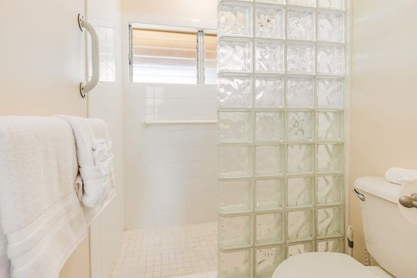Relaxing Master Bath with Convenient Grab Bars & Built-In Bench
