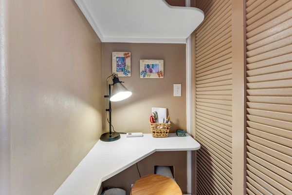 This studio features the perfect desk nook for setting up your laptop.