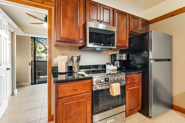 Well equipped kitchen with modern stainless steel appliances and new maple cabinetry.