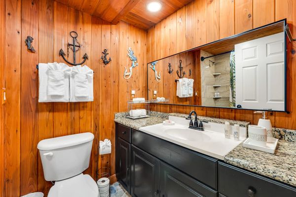 Master bathroom with lots of counter space and a tub/shower combo.