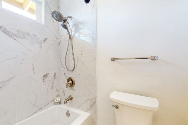 Guest bath with tub/shower combo.