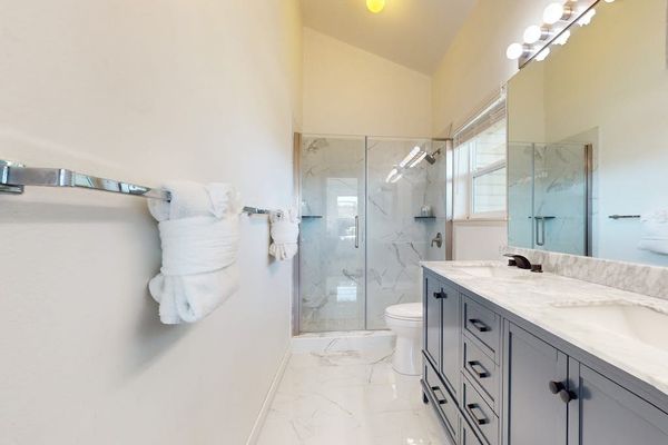 Newly remodeled master bathroom with double sinks and amazing tiled walk-in shower.