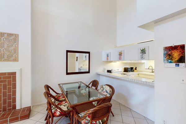Dining room with a table for four, perfect for a game night or dinner in, after a long day.