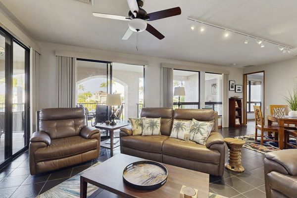 Stretch out on comfortable seating in this bright open-concept living area.