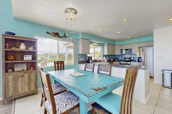 Dining room with seating for six.  Relax from the comfort of your home.