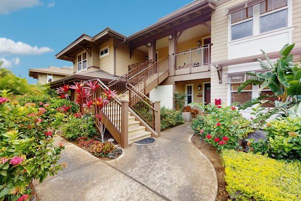 Tropical Exterior Walkway Leading to Property Staircase & Entrance