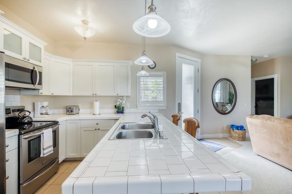 Bright Open-Concept Kitchen Leading to Living & Dining Areas
