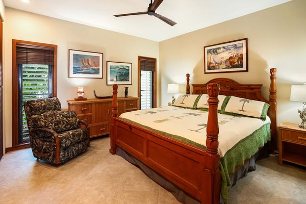 Master bedroom with king bed and an en-suite bathroom.