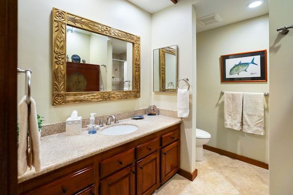 Master shower with double sinks and a large tiled walk-in shower.