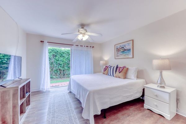 Bright Primary Bedroom with King Bed & Ceiling Fan